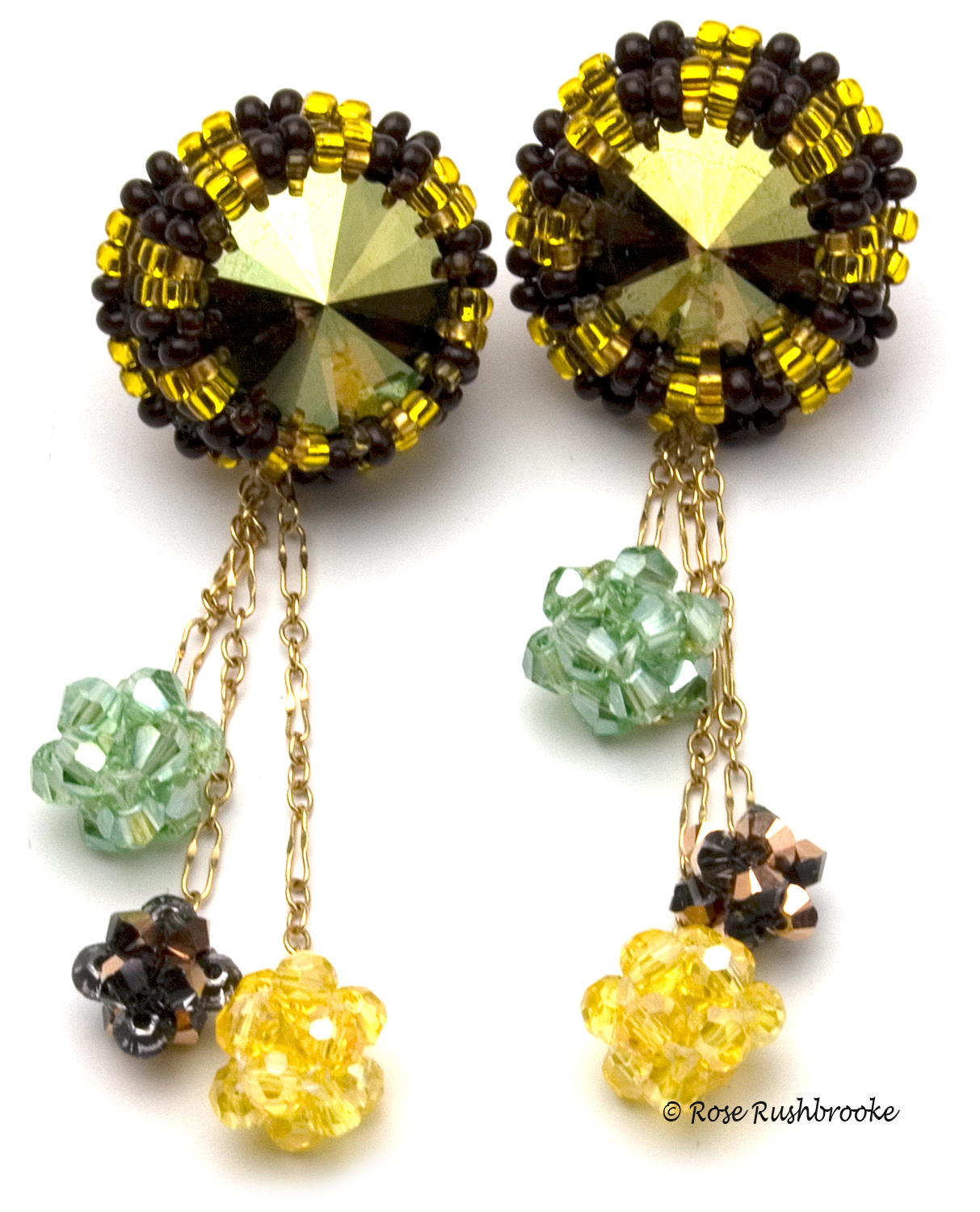 Inspired by a Bee earrings by Rose C Rushbrooke. Bead embroidered and woven - 14mm and 4mm Swarovski crystals, seed beads and gold chain. Image copyright &copy; Rose C Rushbrooke.