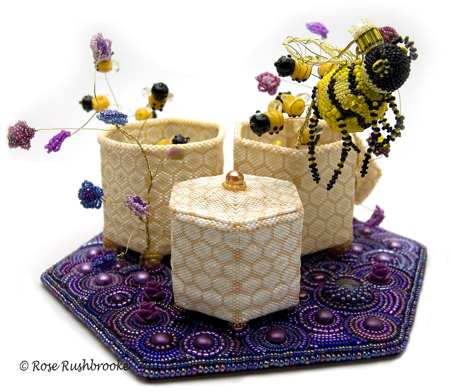 Queen Bee and Swarm, beaded sculpture by Rose Rushbrooke. Bead weaving and embroidery. Seed beads, crystals, Czech glass beads, and copper wire. Finalist in inaugural exhibition Wings and Stings by the Museum of Beadwork. Image copyright &copy; Rose Rushbrooke.