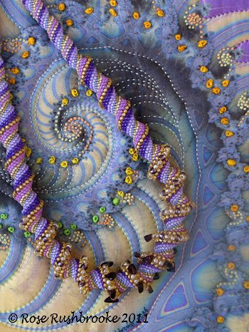 Necklace laid over Royal Crustacean fractal art quilt