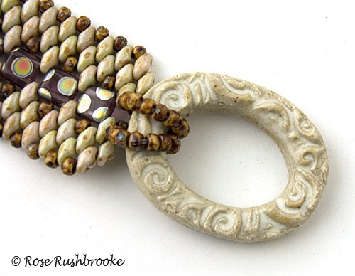 Close up of Stone Tile and superduo bracelet with hand made ceramic clasp.. Image copyright &copy; Rose C Rushbrooke.