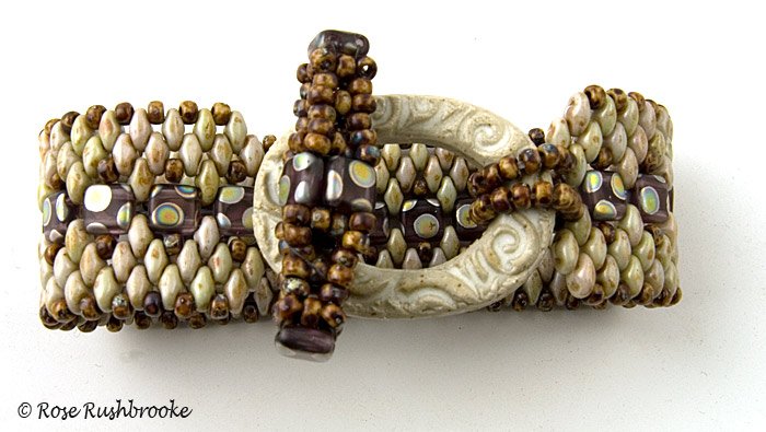 Top view of Stone Tile and superduo bracelet with hand made ceramic clasp.. Image copyright &copy; Rose C Rushbrooke.