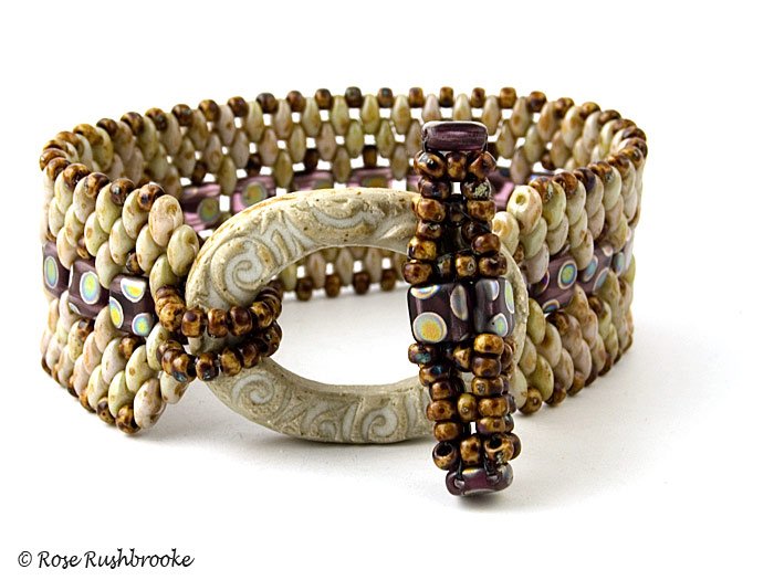 Stone Tile and superduo bracelet with hand made ceramic clasp. Design by Rose C Rushbrooke. Beadwork - peyote stitch. Image copyright &copy; Rose C Rushbrooke.