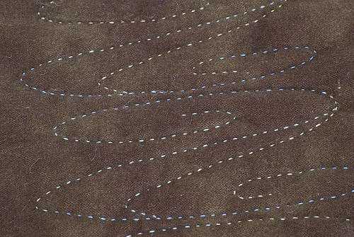 Detail 2 of Anamorphic Oakleaf and Reel - catoptric perspective, cylindrical mirror quilt. Image copyright &copy; Rose Rushbrooke.