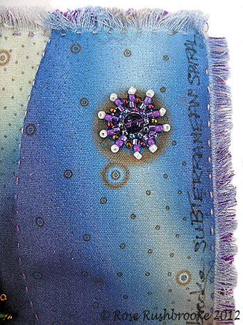 Fringing on the edges of Subterranean Spiral - hybrid quilt. Image copyright &copy; Rose Rushbrooke.