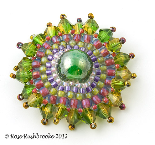 Green Crystal bead circle - beadweaving, glass bead, seed beads and Swarovski crystals. Image copyright &copy; Rose Rushbrooke.