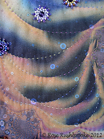 Quilted stitches using variegated cotton quilting thread. Image copyright &copy; Rose Rushbrooke.