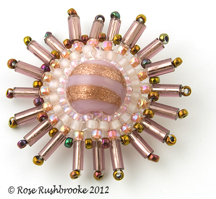 Spiky bugle circles - bead weaving, glass bead, bugle and seed beads. Image copyright &copy; Rose Rushbrooke.